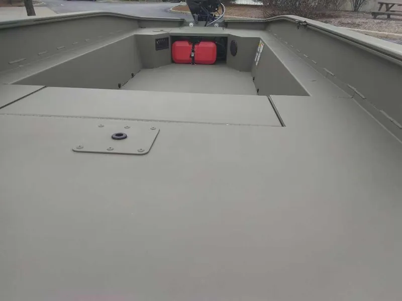 Slide: The Image of 2025 Tracker Grizzly 1650 T Prairie Wings Edition boat interior, featuring spacious deck and storage. - 3