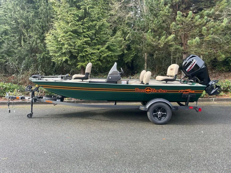 The Image of 2025 Tracker Bass Tracker Classic Limited boat on trailer, parked outdoors. - 0
