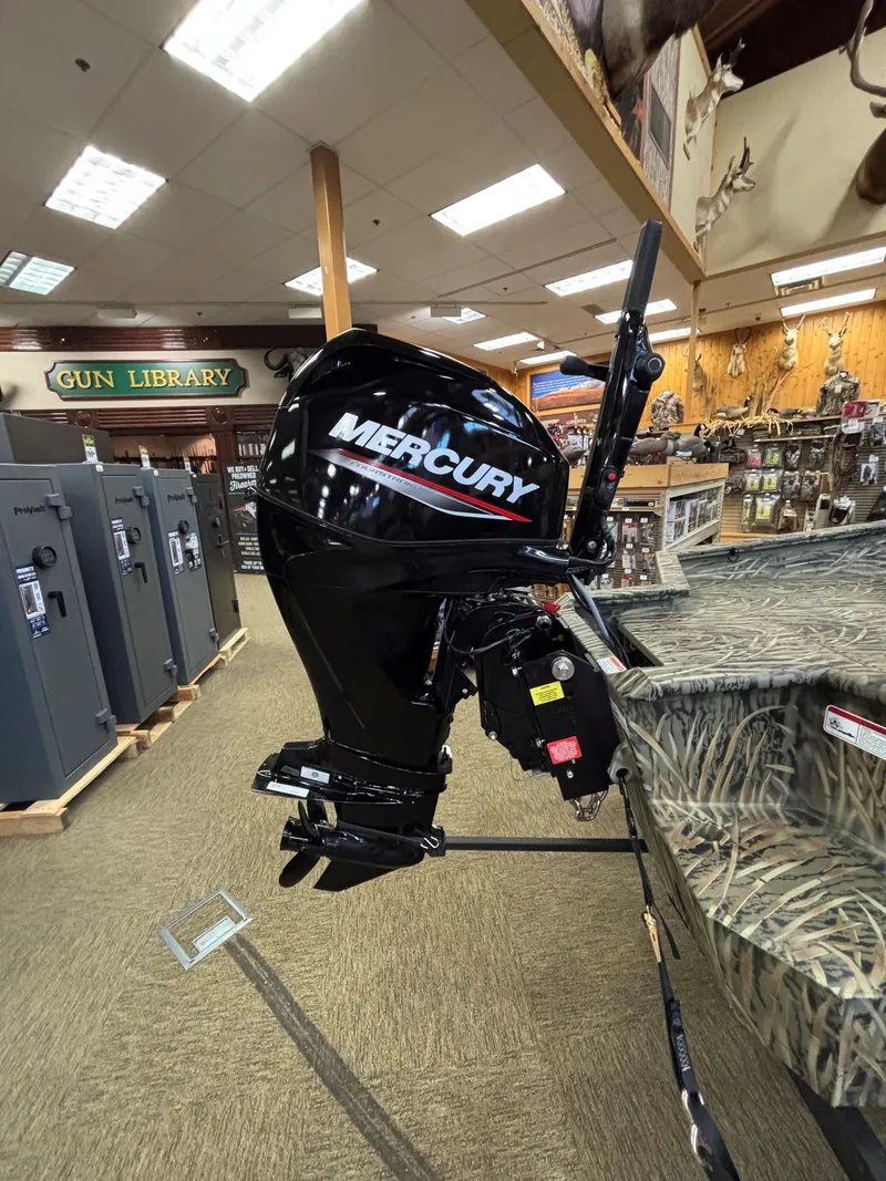 Slide: The Image of 2025 Tracker Grizzly 1650 T Prairie Wings Edition with Mercury outboard motor in showroom. - 8