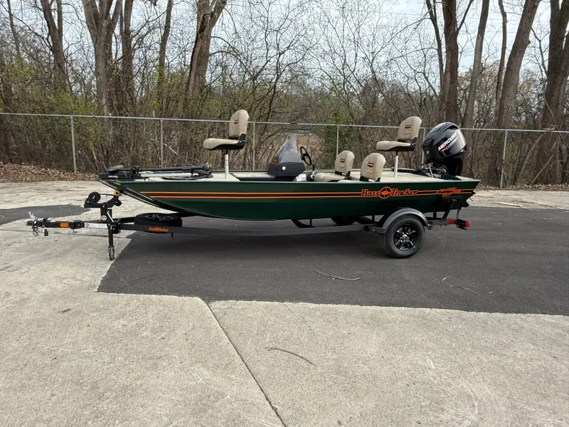 Slide: The Image of 2025 Tracker Bass Tracker Classic Limited boat on trailer, parked outdoors. - 45