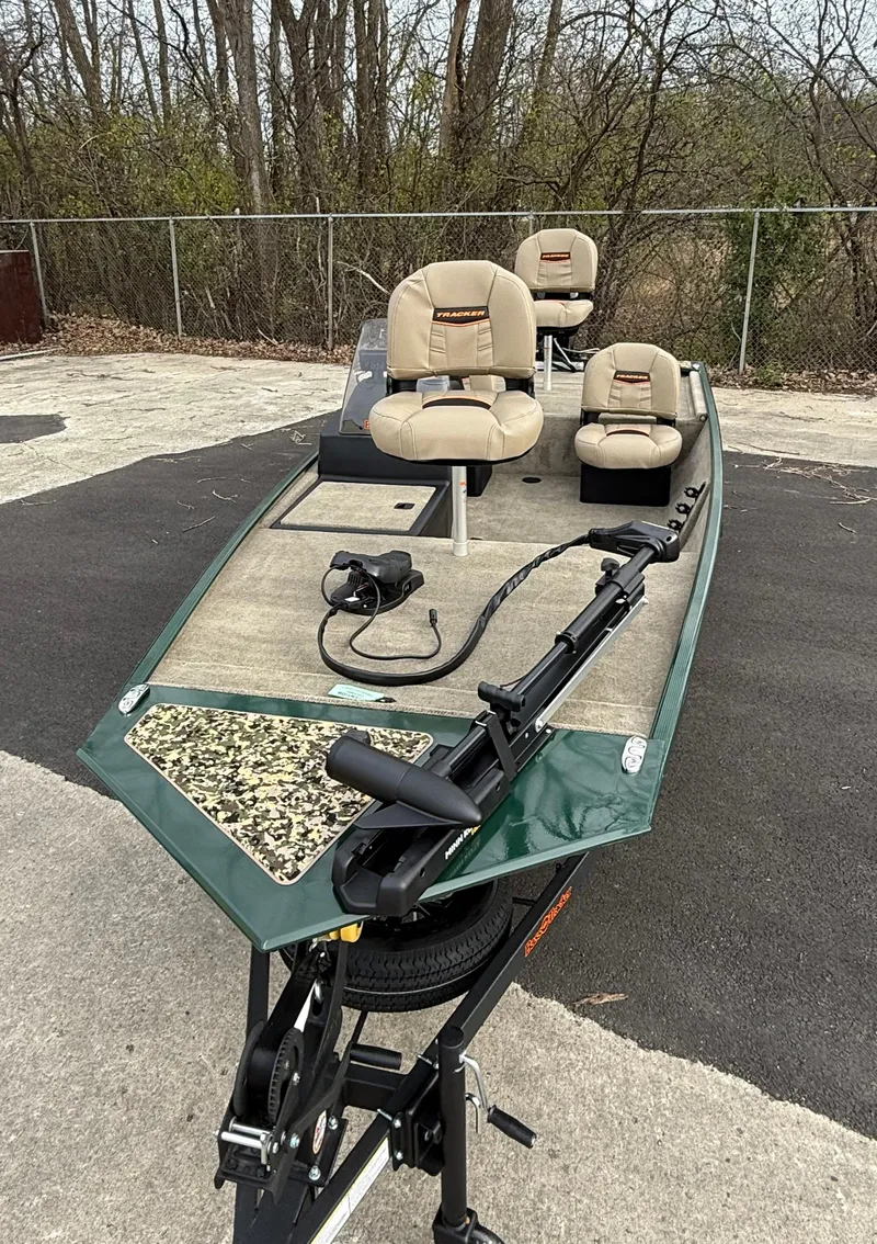 Slide: The Image of 2025 Tracker Bass Tracker Classic Limited fishing boat with seating and trolling motor. - 46