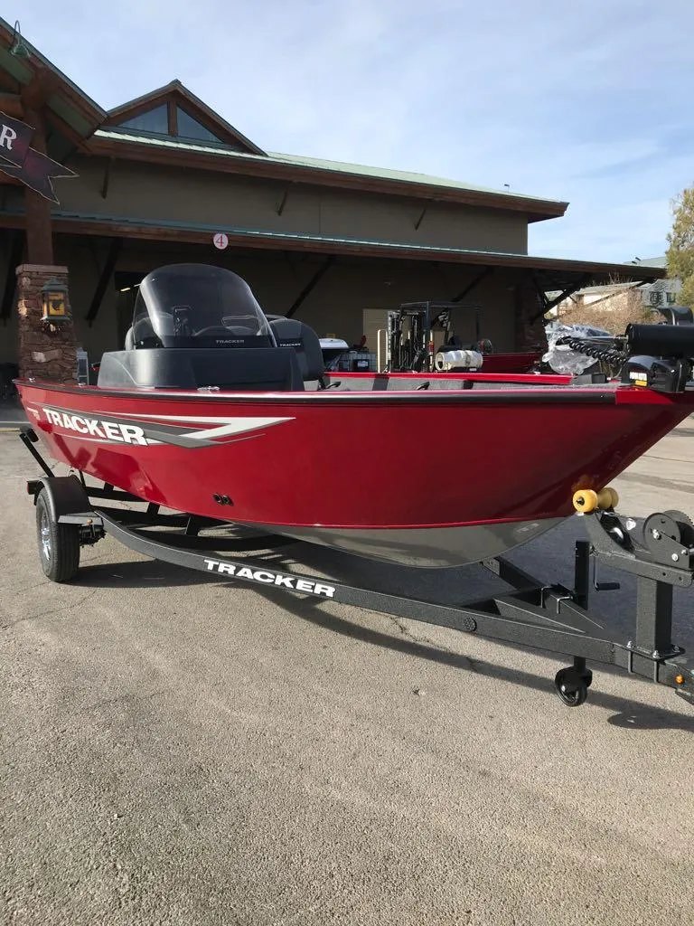 Slide: The Image of 2025 Tracker Pro Guide V-16 SC boat in vibrant red on trailer. - 3