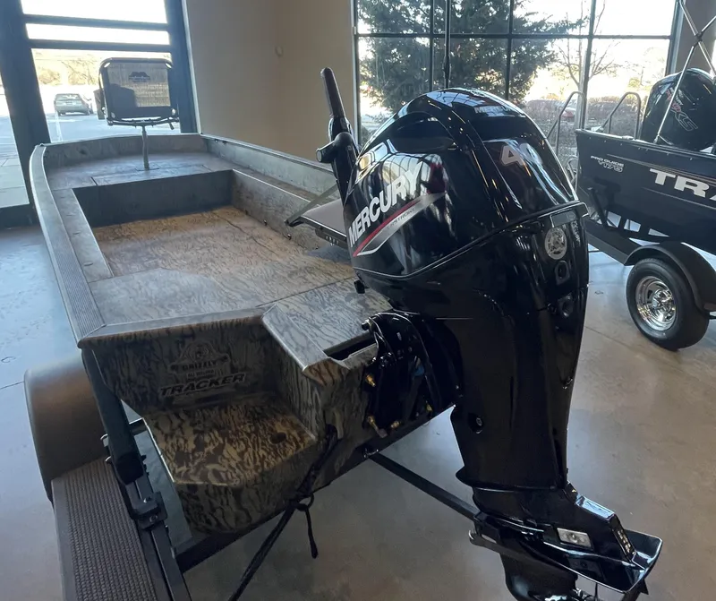 Slide: The Image of 2025 Tracker Grizzly 1650 T Prairie Wings Edition boat with Mercury outboard motor. - 2