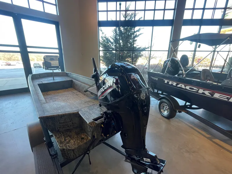 Slide: The Image of 2025 Tracker Grizzly 1650 T Prairie Wings Edition boat with Mercury engine in showroom. - 4