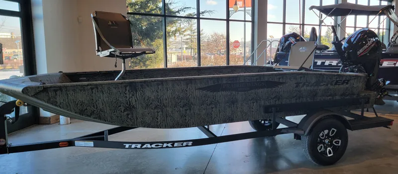 Slide: The Image of 2025 Tracker Grizzly 1650 T Prairie Wings Edition boat on display in showroom. - 7