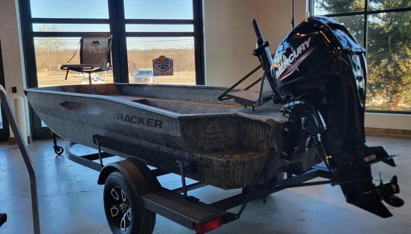 Slide: The Image of 2025 Tracker Grizzly 1650 T Prairie Wings Edition boat with Mercury outboard motor. - 8
