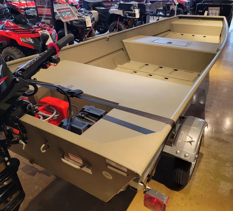 Slide: The Image of 2025 Tracker Grizzly 1542 Utility boat displayed in showroom. - 4