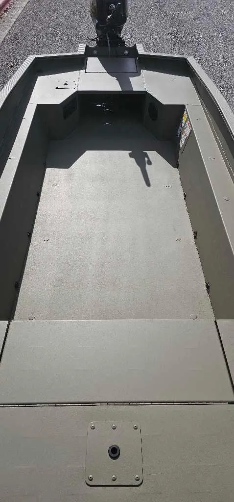 Slide: The Image of 2025 Tracker Grizzly 1650 T Prairie Wings Edition boat interior, spacious and durable design. - 4