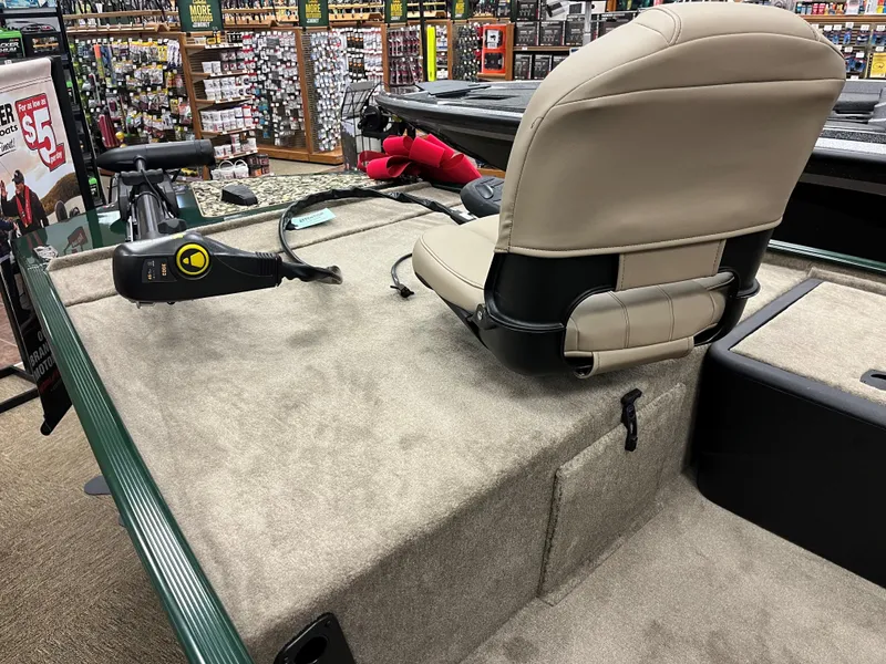 Slide: The Image of 2025 Tracker Bass Tracker Classic Limited boat interior with beige seat and control panel. - 10