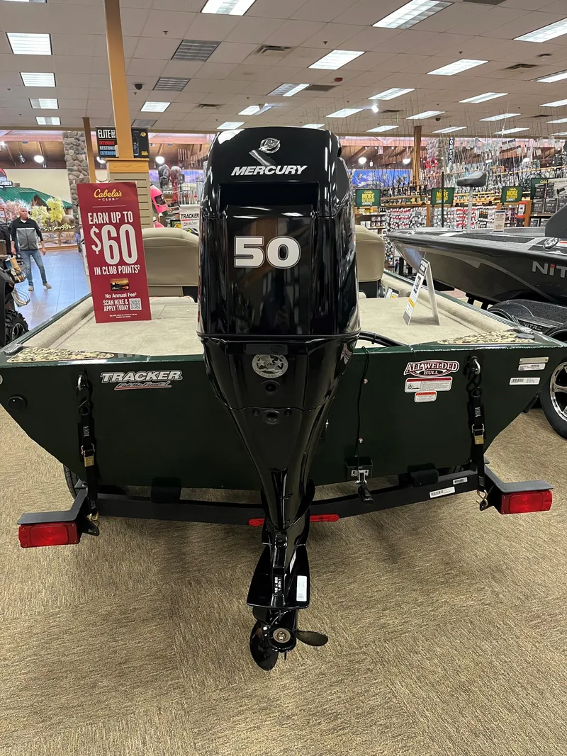 Slide: The Image of 2025 Tracker Bass Tracker Classic Limited boat with Mercury 50 engine in showroom. - 4