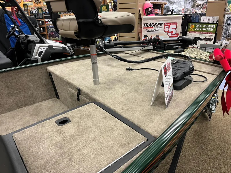 Slide: The Image of 2025 Tracker Bass Tracker Classic Limited boat interior with seating and fishing equipment. - 9