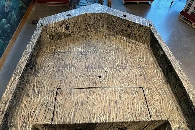 Slide: The Image of 2025 Tracker Grizzly 1650 T Prairie Wings Edition boat with camouflage interior design. - 3