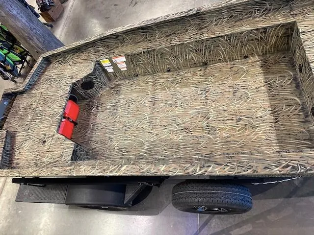 Slide: The Image of 2025 Tracker Grizzly 1650 T Prairie Wings Edition boat with camouflage interior design. - 9