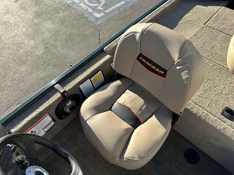 Slide: The Image of 2025 Tracker Bass Tracker Classic Limited boat seat, beige with black and orange accents. - 13