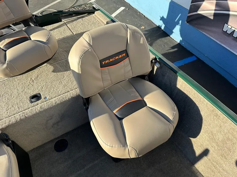 Slide: The Image of 2025 Tracker Bass Tracker Classic Limited boat seat, beige with orange accents. - 14