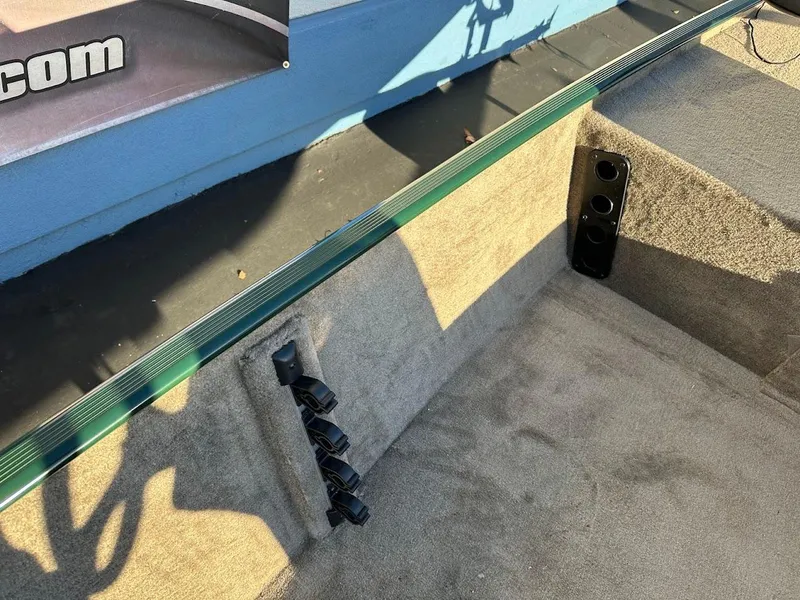 Slide: The Image of 2025 Tracker Bass Tracker Classic Limited boat interior with carpeted storage area. - 15