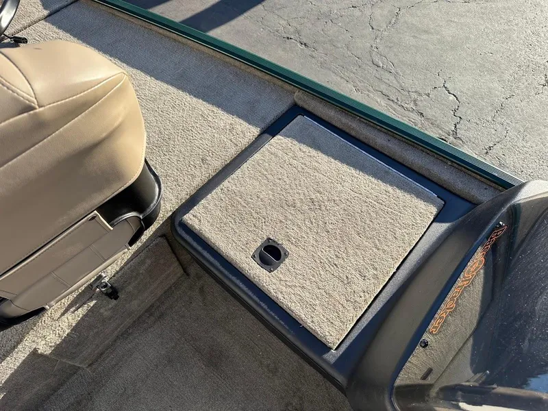 Slide: The Image of 2025 Tracker Bass Tracker Classic Limited boat interior with carpeted storage compartment. - 16