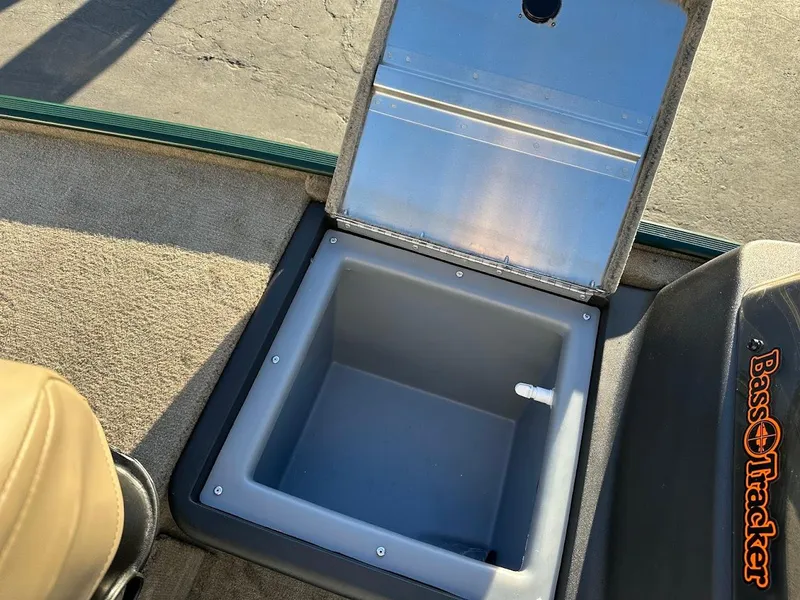 Slide: The Image of 2025 Tracker Bass Tracker Classic Limited boat storage compartment open. - 17
