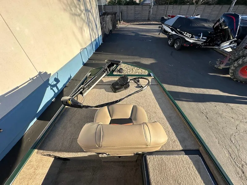 Slide: The Image of 2025 Tracker Bass Tracker Classic Limited boat deck with seating and equipment. - 18