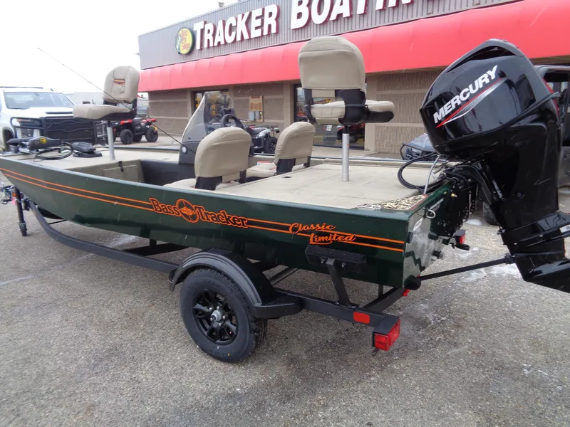 Slide: The Image of 2025 Tracker Bass Tracker Classic Limited boat with Mercury engine at dealership. - 2