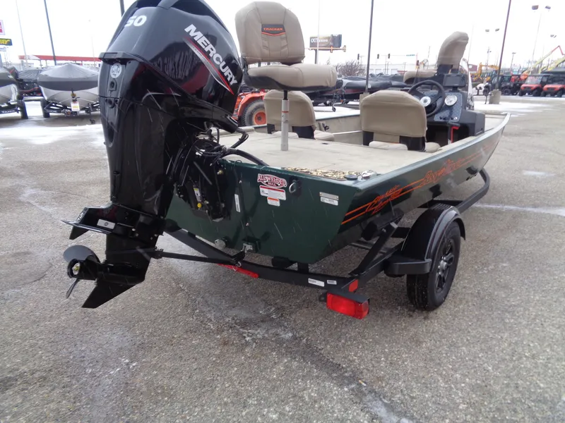 Slide: The Image of 2025 Tracker Bass Tracker Classic Limited boat with Mercury engine on trailer. - 4