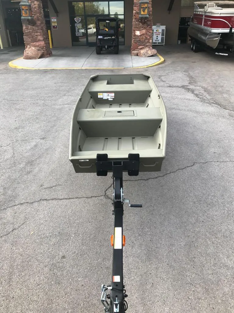 Slide: The Image of 2025 Tracker Grizzly 1542 Utility boat on trailer in parking lot. - 7