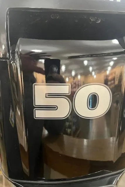 Slide: The Image of 2025 Tracker Bass Tracker Classic Limited engine with "50" horsepower marking. - 11