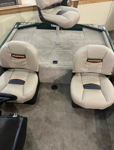 Slide: The Image of 2025 Tracker Bass Tracker Classic Limited boat interior with beige seats. - 2