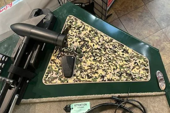 Slide: The Image of 2025 Tracker Bass Tracker Classic Limited boat with camouflage deck and trolling motor. - 5