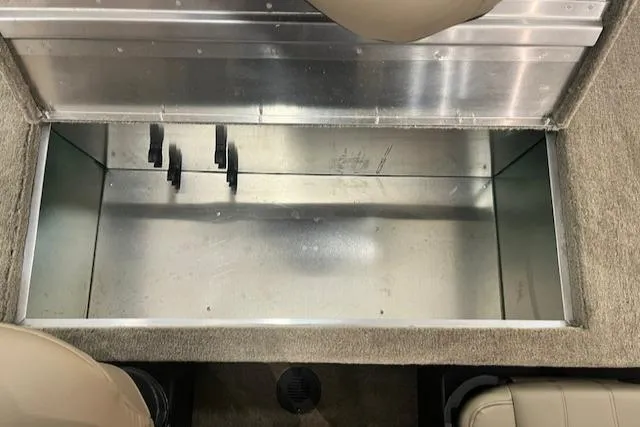 Slide: The Image of 2025 Tracker Bass Tracker Classic Limited storage compartment interior. - 8