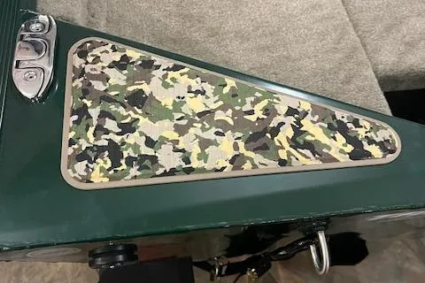 Slide: The Image of 2025 Tracker Bass Tracker Classic Limited with camouflage detail on green surface. - 9