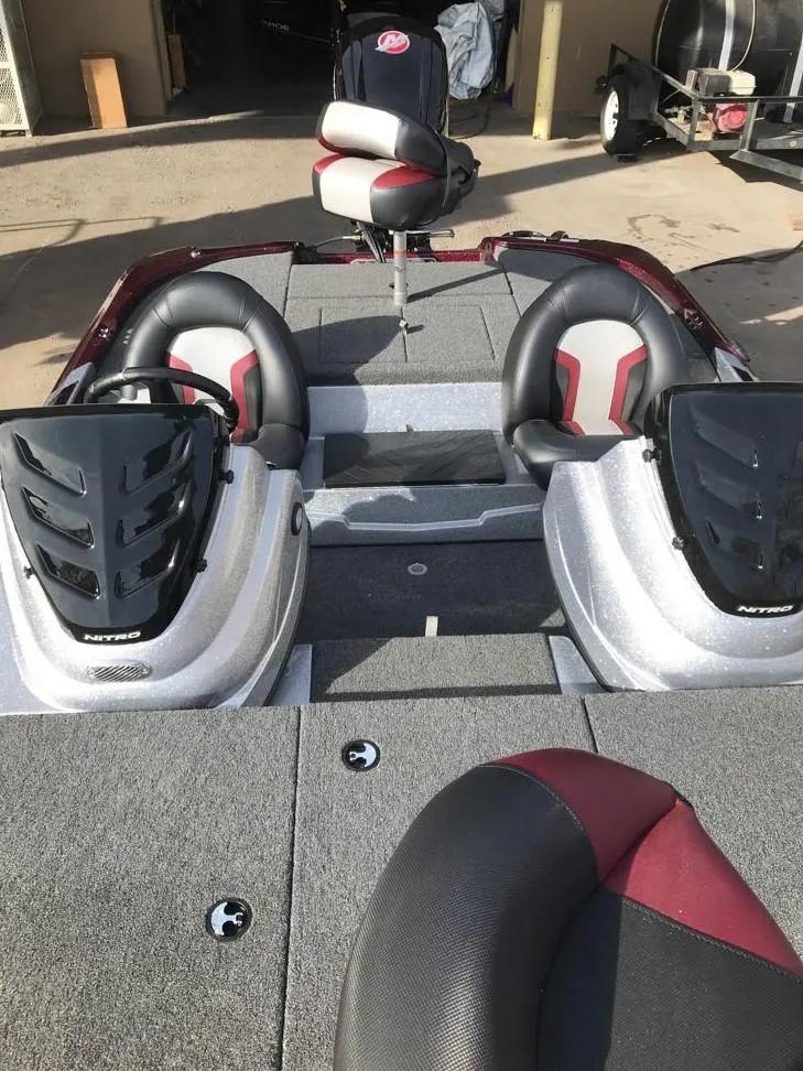 Slide: The Image of 2025 Nitro Z17 boat interior with dual seats and steering consoles. - 11