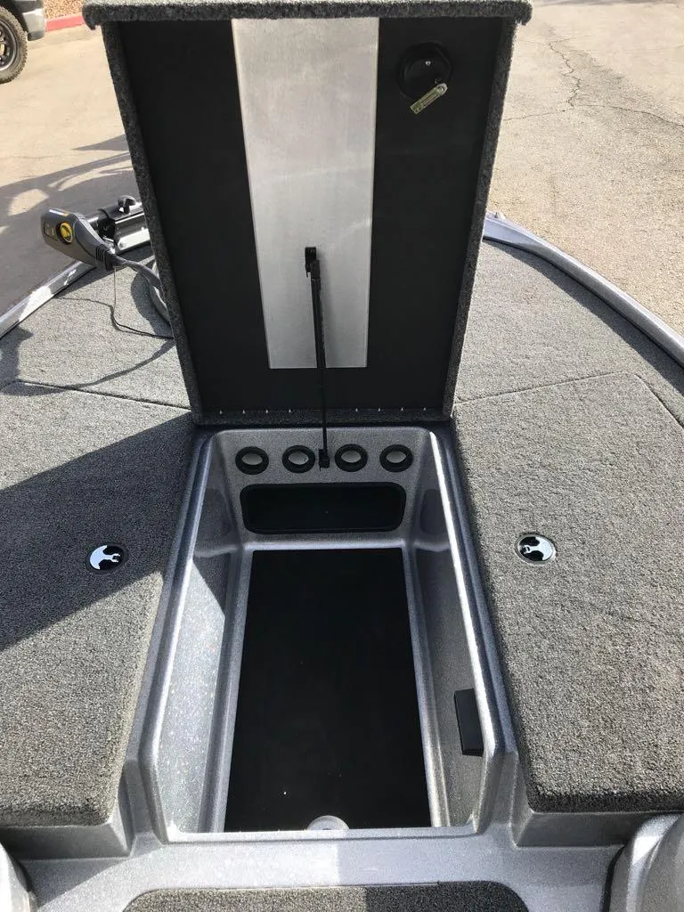 Slide: The Image of 2025 Nitro Z17 boat storage compartment with open lid, showcasing interior space. - 12