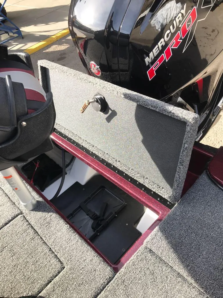 Slide: The Image of 2025 Nitro Z17 boat with Mercury Pro engine, open storage compartment. - 13