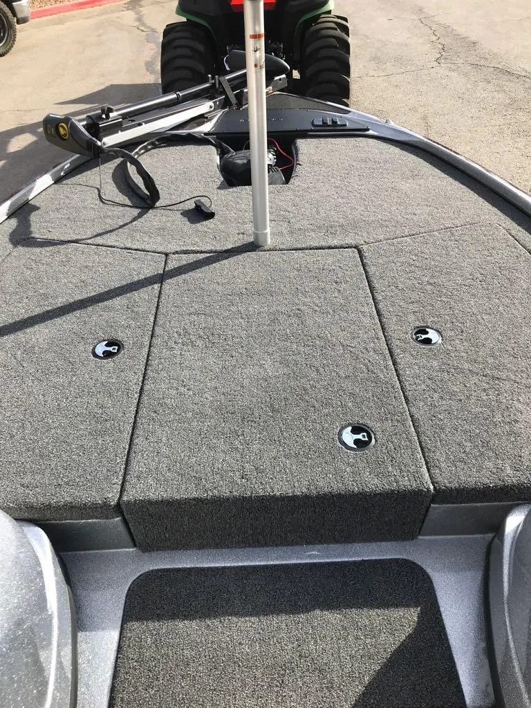 Slide: The Image of 2025 Nitro Z17 boat deck with carpeted surface and storage compartments. - 14