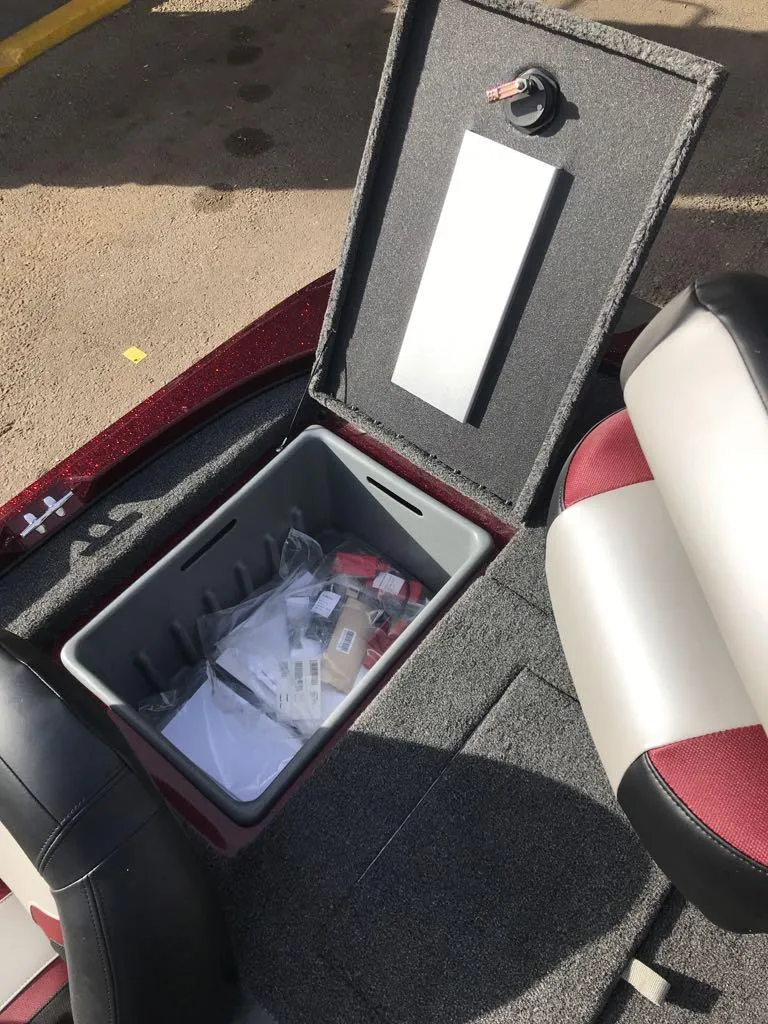 Slide: The Image of 2025 Nitro Z17 boat storage compartment with organized gear and accessories. - 15