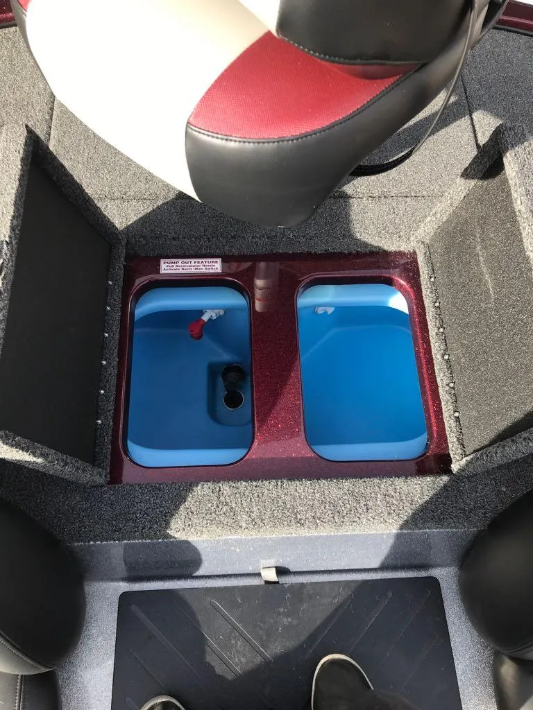 Slide: The Image of 2025 Nitro Z17 boat storage compartments with blue interior. - 16