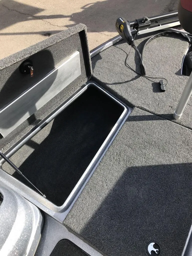 Slide: The Image of Open storage compartment on 2025 Nitro Z17 boat deck. - 19