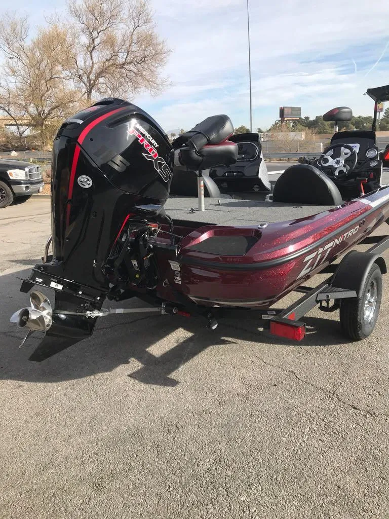 Slide: The Image of 2025 Nitro Z17 boat with powerful outboard motor, parked on a trailer. - 3