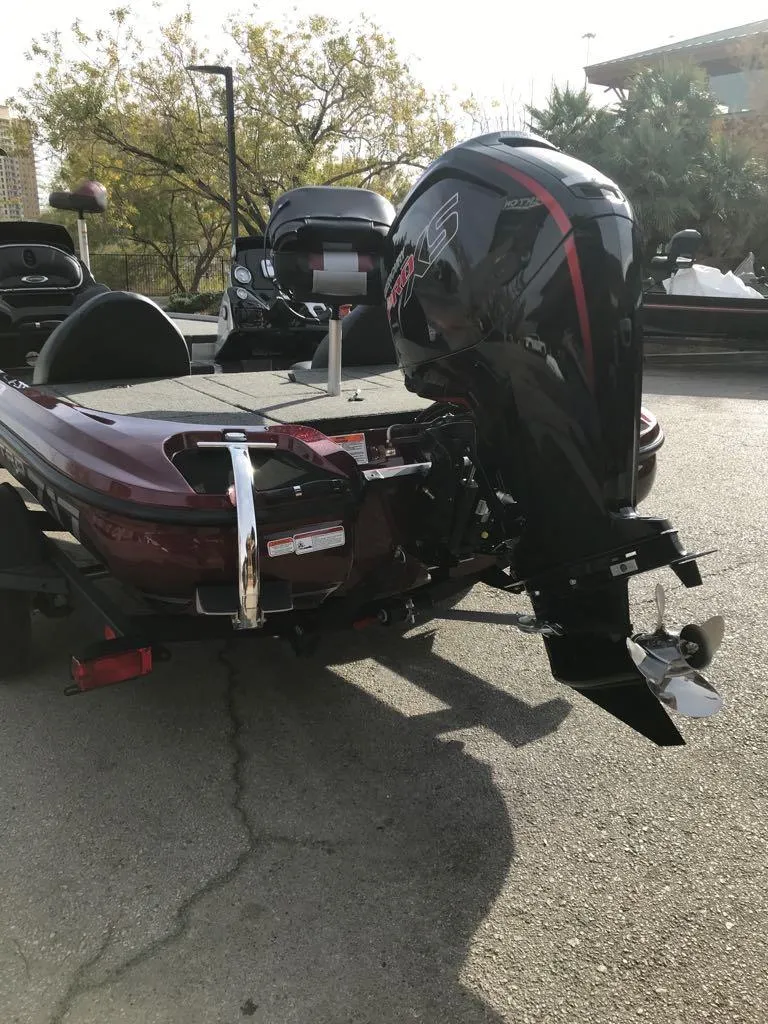 Slide: The Image of 2025 Nitro Z17 boat with powerful outboard motor, parked on pavement. - 4