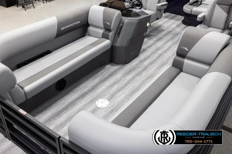 Slide: The Image of 2025 Bennington 23 SSBSE pontoon boat interior with gray seating and striped flooring. - 10