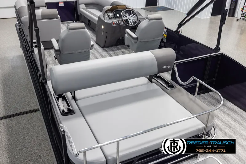 Slide: The Image of 2025 Bennington 23 SSBSE pontoon boat interior with gray seating and steering console. - 11