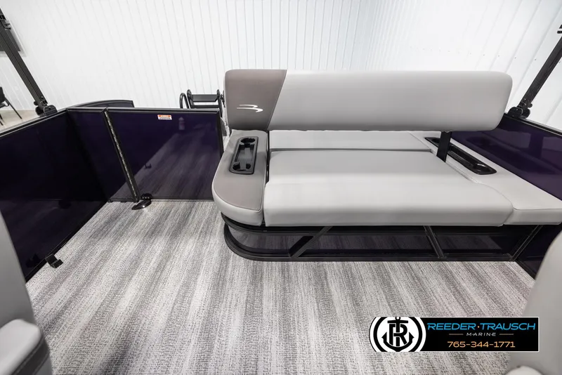 Slide: The Image of 2025 Bennington 23 SSBSE pontoon boat interior with gray seating and carpeted flooring. - 15