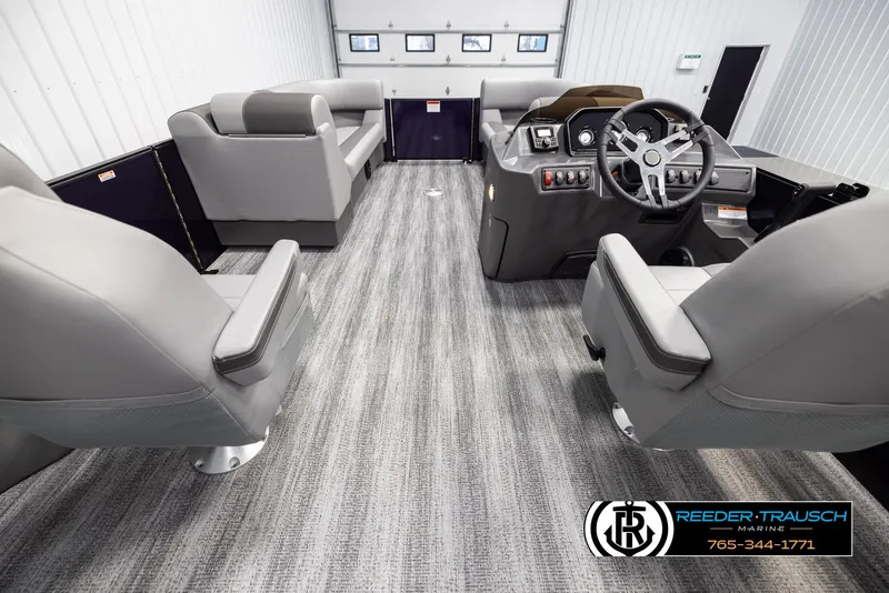 Slide: The Image of 2025 Bennington 23 SSBSE boat interior with modern seating and steering console. - 17