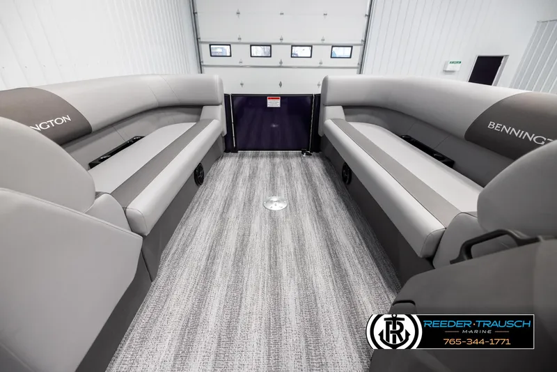 Slide: The Image of 2025 Bennington 23 SSBSE boat interior with gray seating and carpet flooring. - 18
