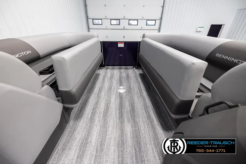 Slide: The Image of 2025 Bennington 23 SSBSE pontoon boat interior with gray seating and carpet flooring. - 20