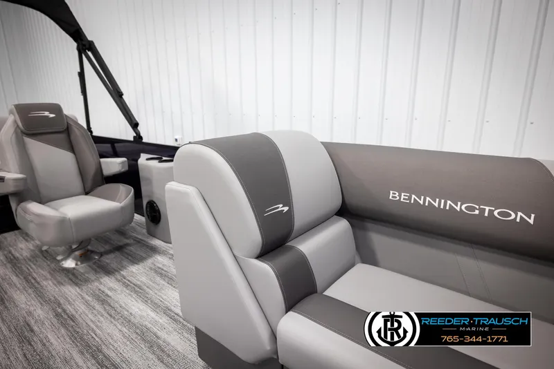Slide: The Image of 2025 Bennington 23 SSBSE boat interior with gray seating and logo. - 21