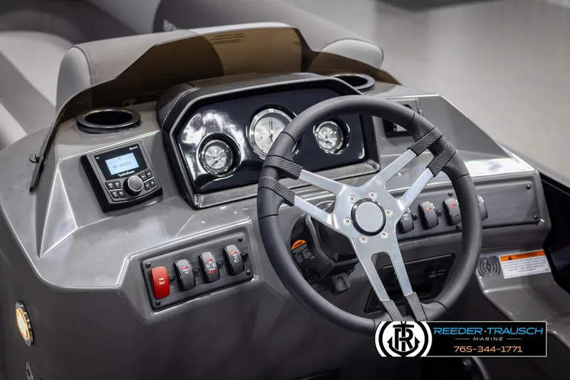 Slide: The Image of 2025 Bennington 23 SSBSE boat dashboard with steering wheel and control panel. - 28