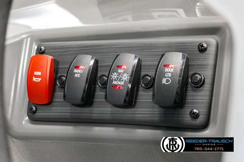 Slide: The Image of Control panel of 2025 Bennington 23 SSBSE boat with switches for horn, radio, anchor, and dock lights. - 30