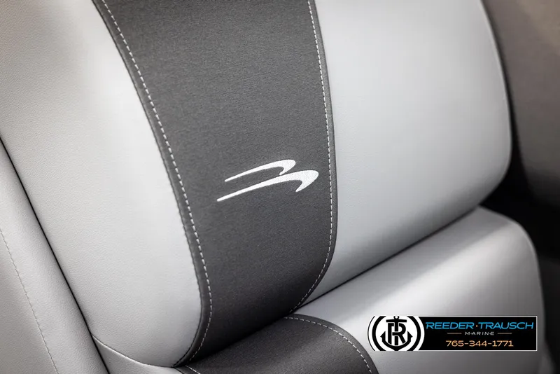 Slide: The Image of 2025 Bennington 23 SSBSE boat seat with logo, featuring gray and black upholstery. - 39